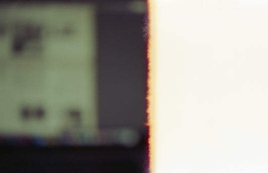 a blurry photo of a cell phone with a blurry background