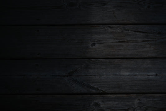 a dark wood background with a black background