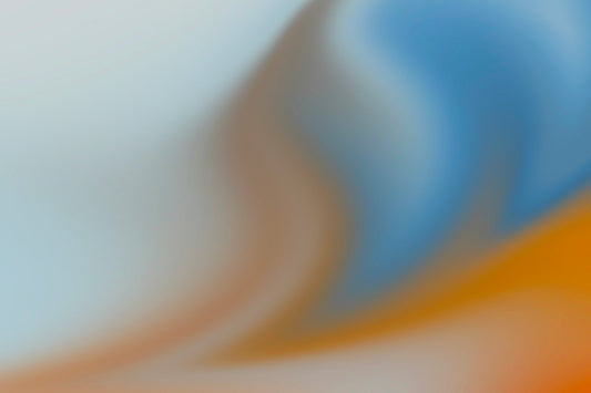 a blurry image of an orange and blue background