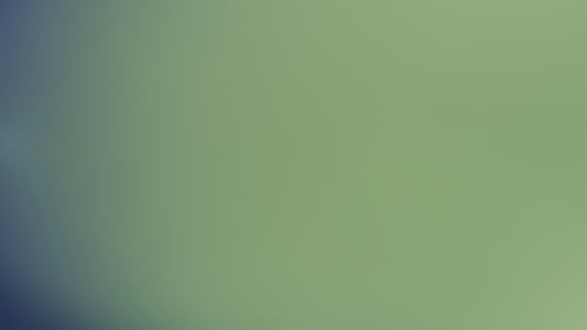 The image shows a blurry, greenish-blue gradient.