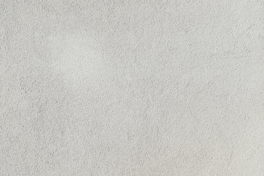 a close up of a white stucco wall