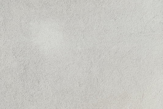a close up of a white stucco wall