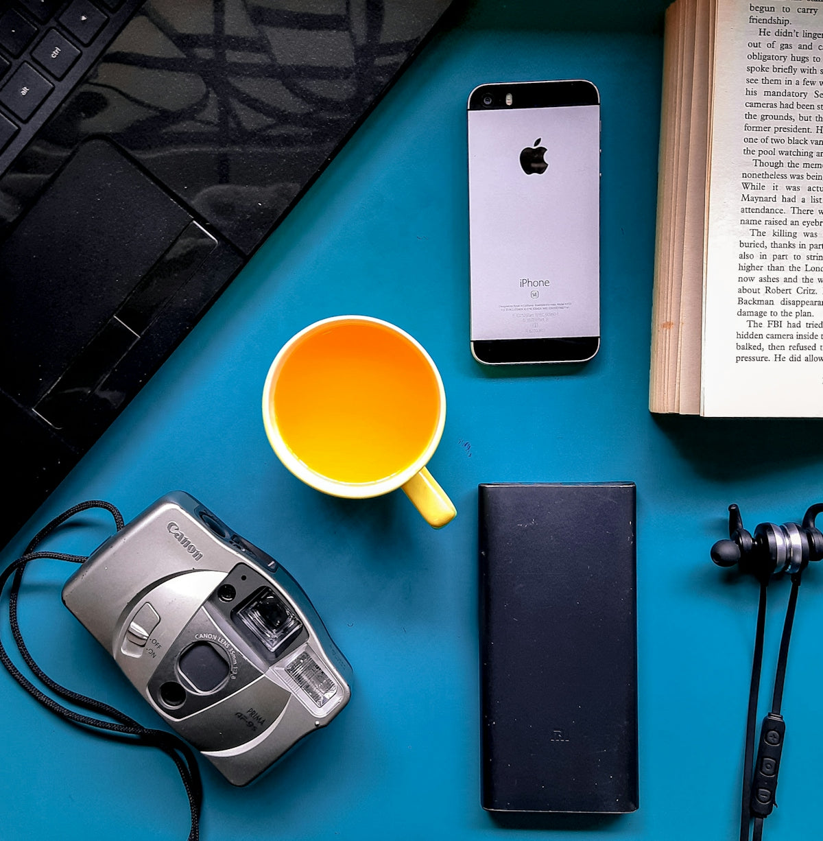silver iphone 6 beside silver and black camera
