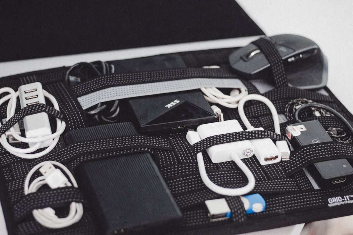 a black case filled with electronics and cords