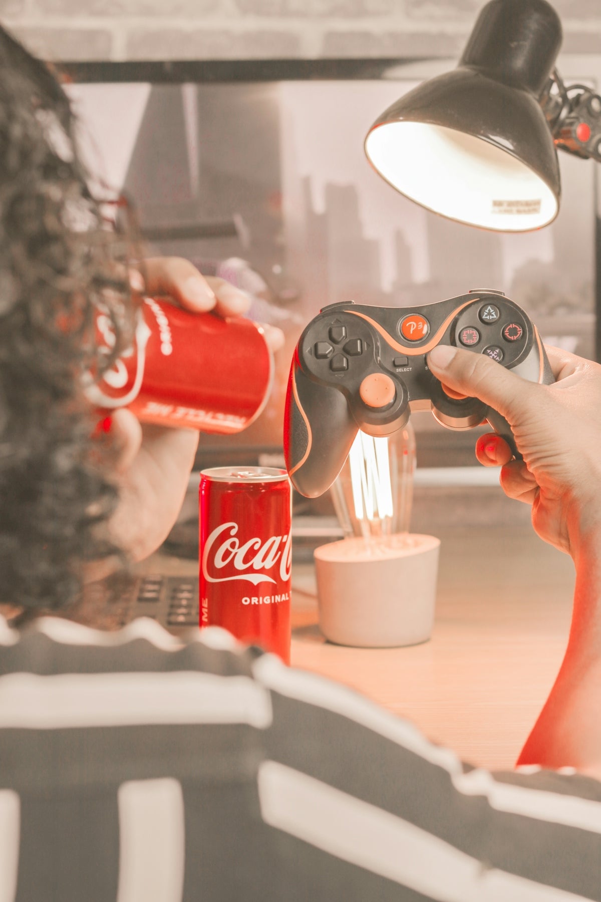 a man is playing a video game with a remote controller