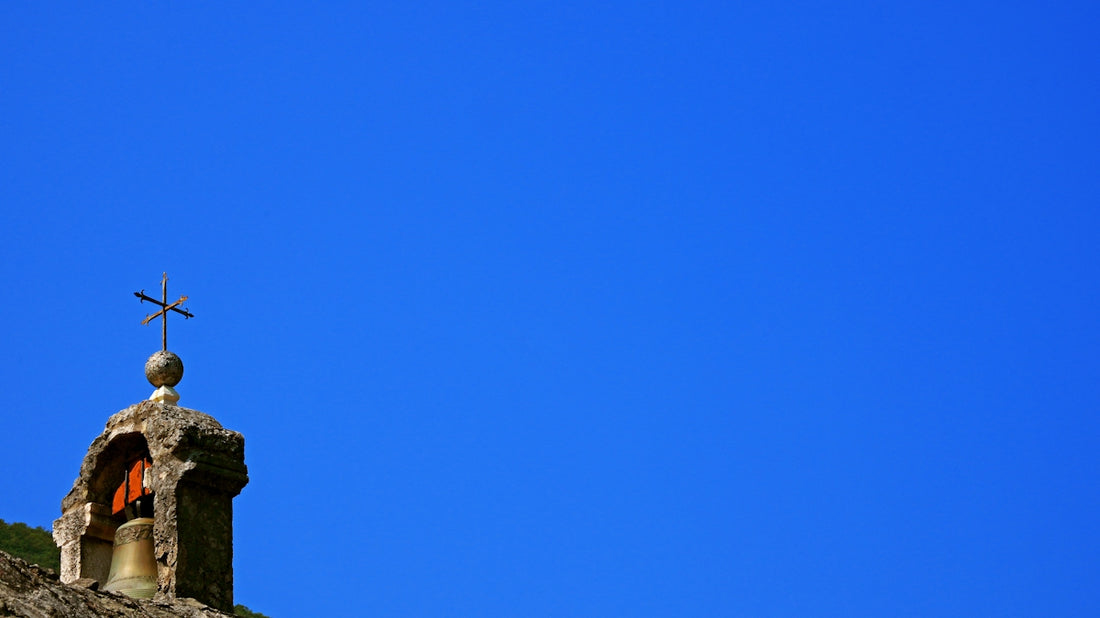 A church steeple with a cross on top