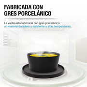 Tazón y plato de gres negro Casa Litus dentro de un horno de microondas
