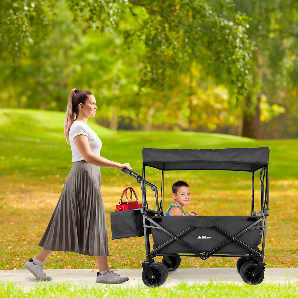 Carrito plegable HIKEO con toldo usado en un parque, vista lateral